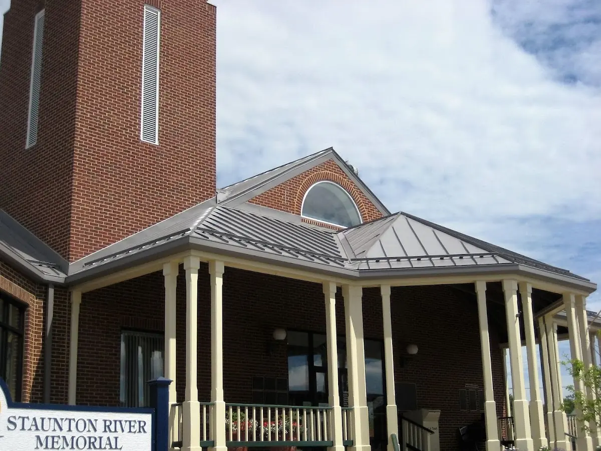 Skilled roofing craftsmen working on a residential roof in Carnesville